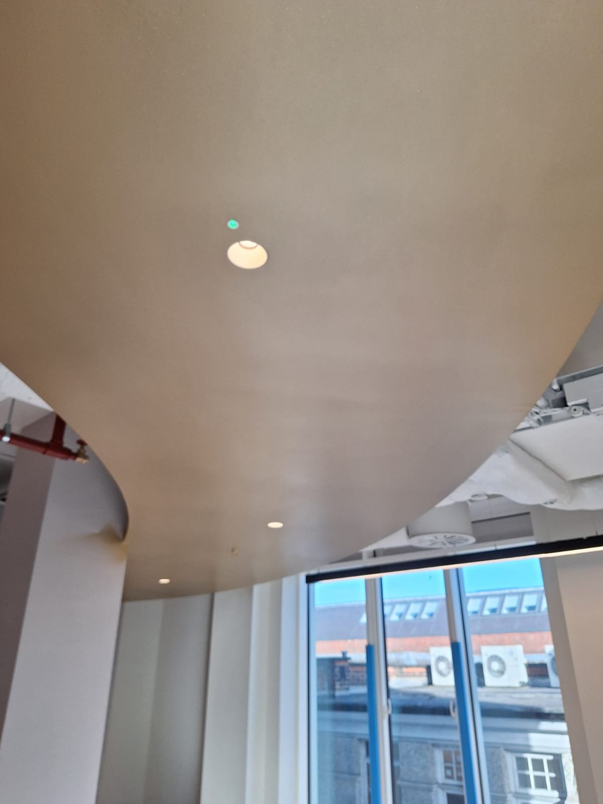 Curved plasterboard bulkhead ceiling taped and jointed to a flush, seam-free finish