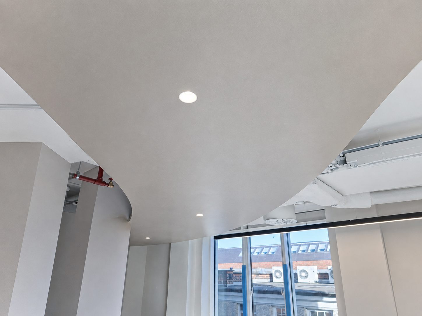 Smooth curved plasterboard ceiling finished ready for painting